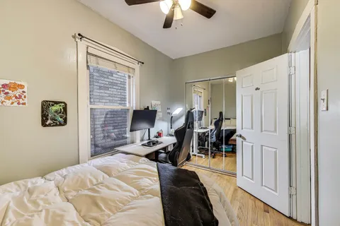 a bed room with a bed and a chandelier