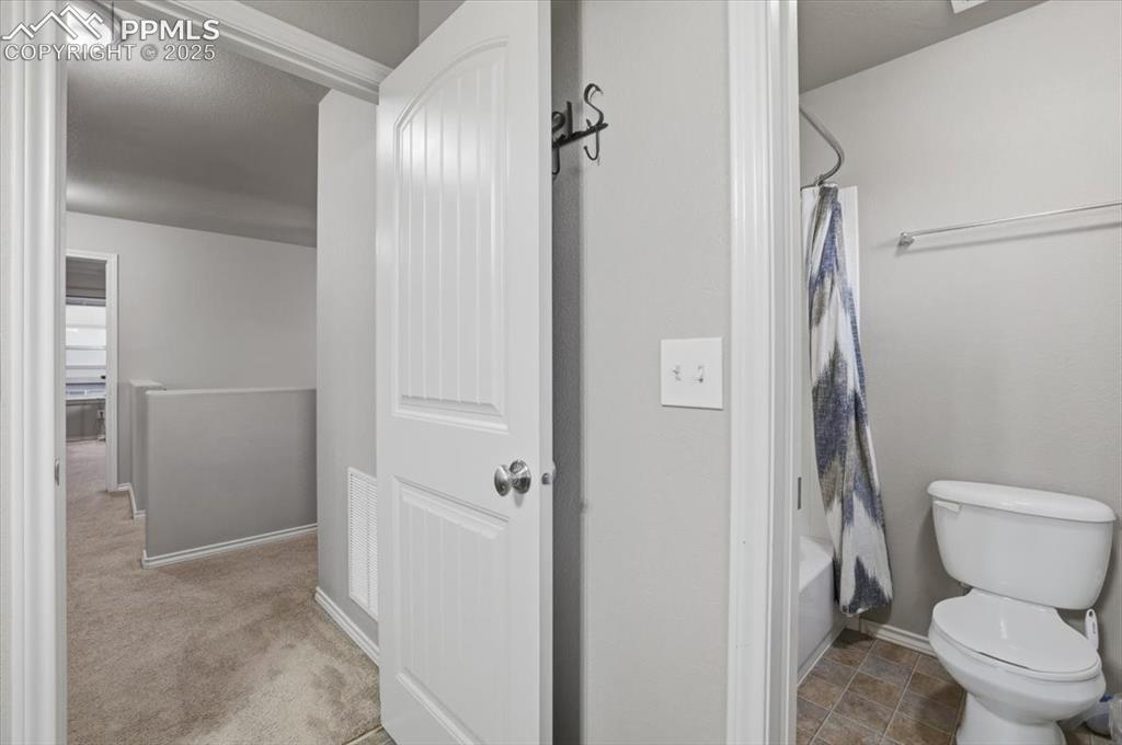 2374 Cinnabar Road Colorado Springs, CO 80921 - Photo 36 of 48 The second upper level bathroom has a tub/shower combo and serves the second and third upper bedrooms. It has dual sinks as well.