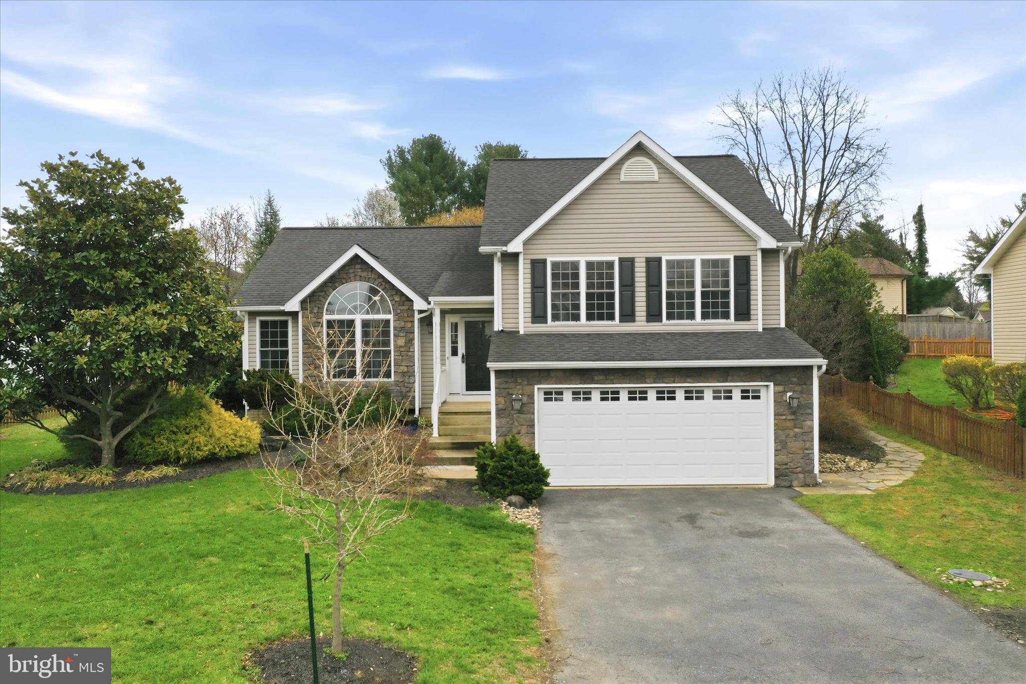 88 Grassy Meadow Road Charles Town, WV 25414 - Photo 1 of 44 a front view of a house with a yard and garage