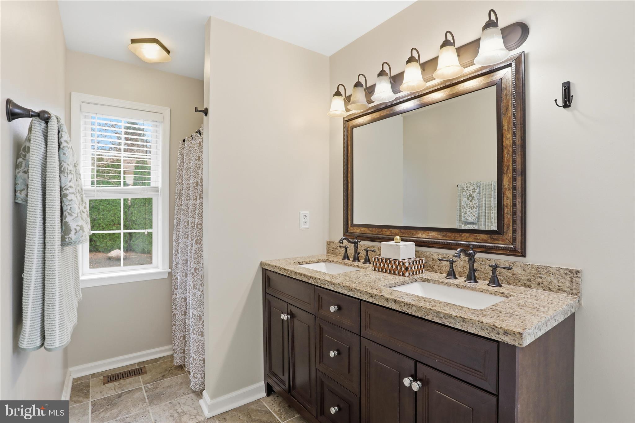 88 Grassy Meadow Road Charles Town, WV 25414 - Photo 17 of 44 a bathroom with a granite countertop sink and a mirror