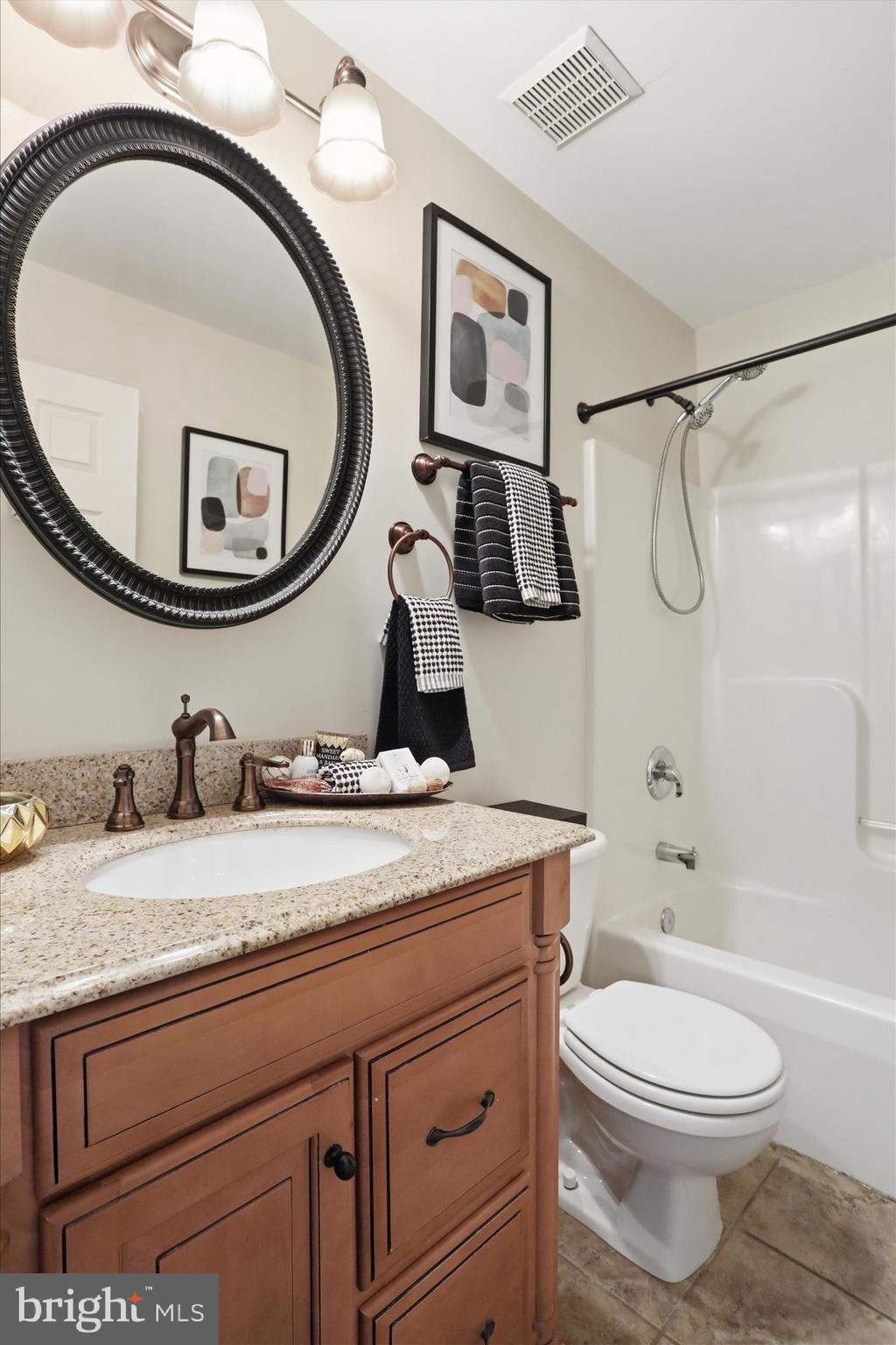 88 Grassy Meadow Road Charles Town, WV 25414 - Photo 21 of 44 a bathroom with a granite countertop toilet sink and mirror