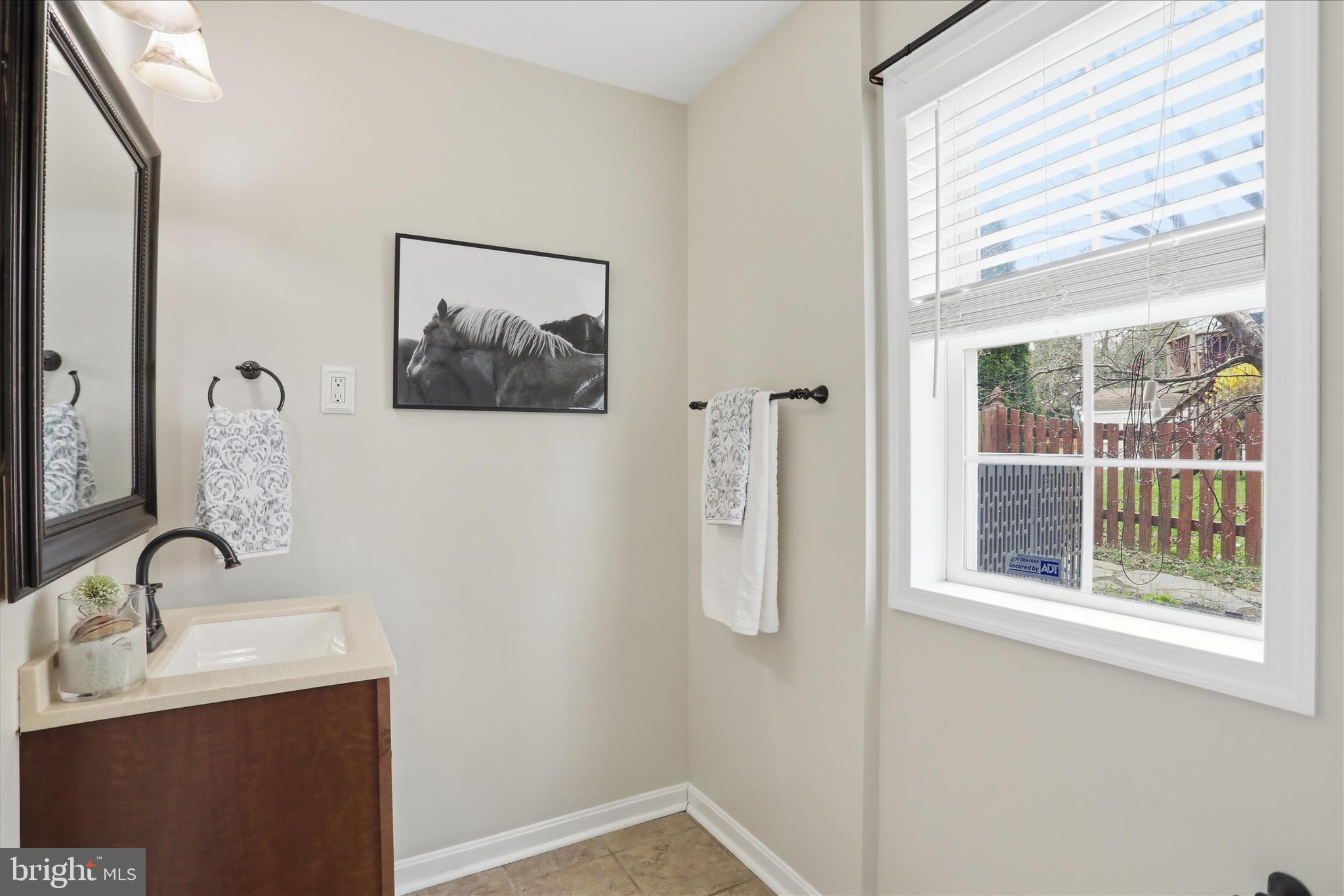 88 Grassy Meadow Road Charles Town, WV 25414 - Photo 29 of 44 a bathroom with a sink and a window