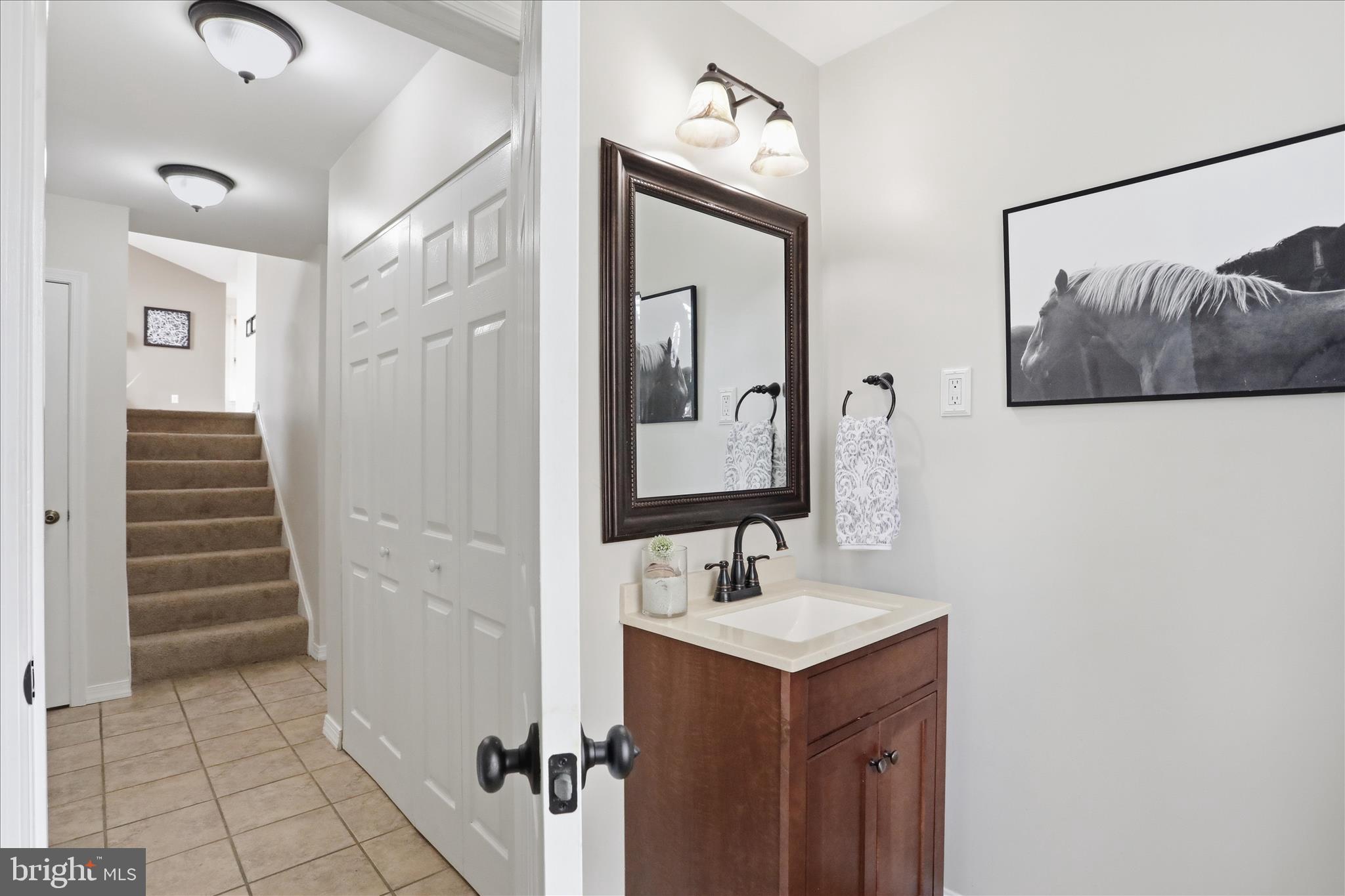 88 Grassy Meadow Road Charles Town, WV 25414 - Photo 30 of 44 a bathroom with a sink and a mirror