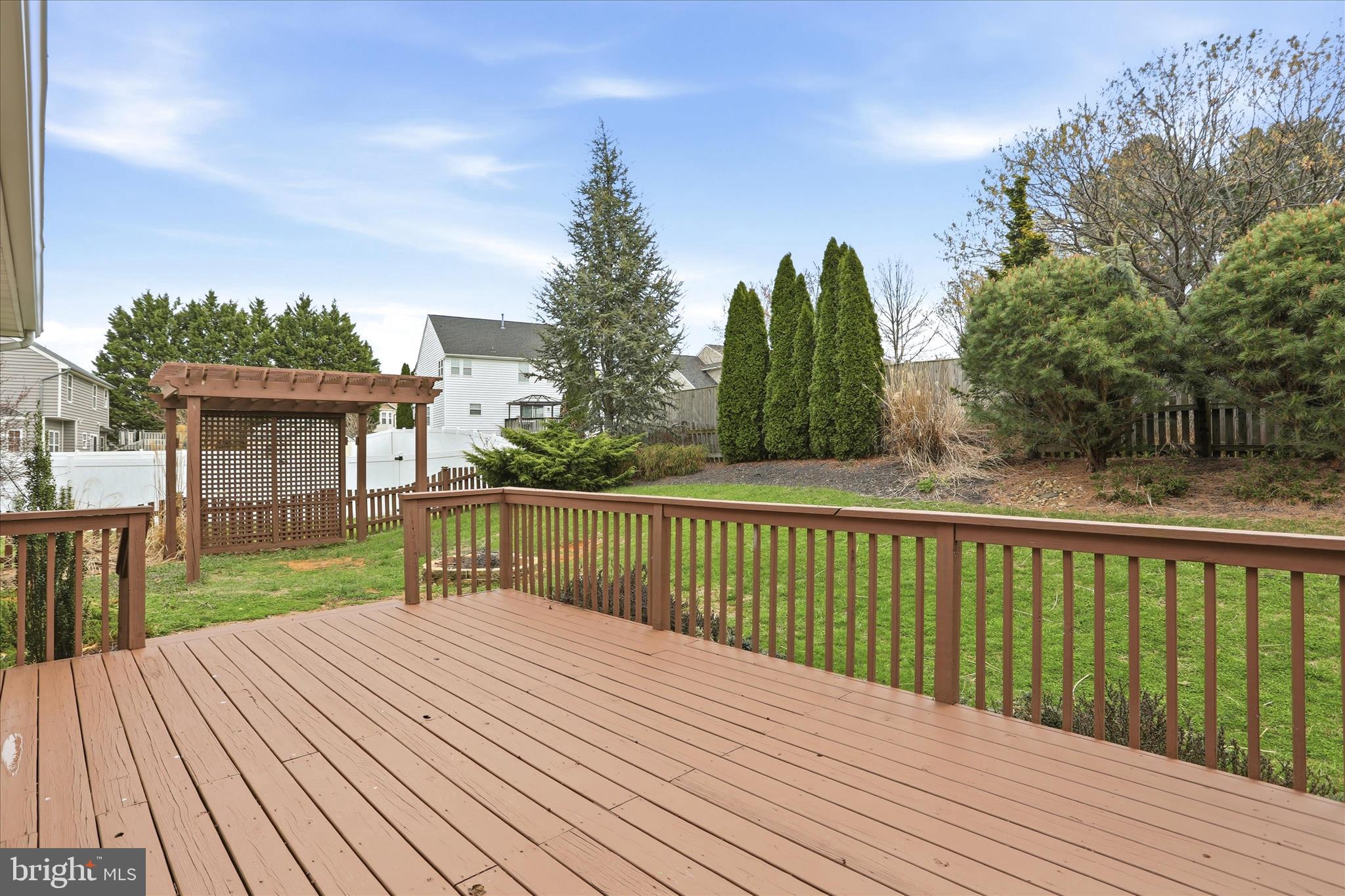 88 Grassy Meadow Road Charles Town, WV 25414 - Photo 32 of 44 a view of a wooden deck with a yard