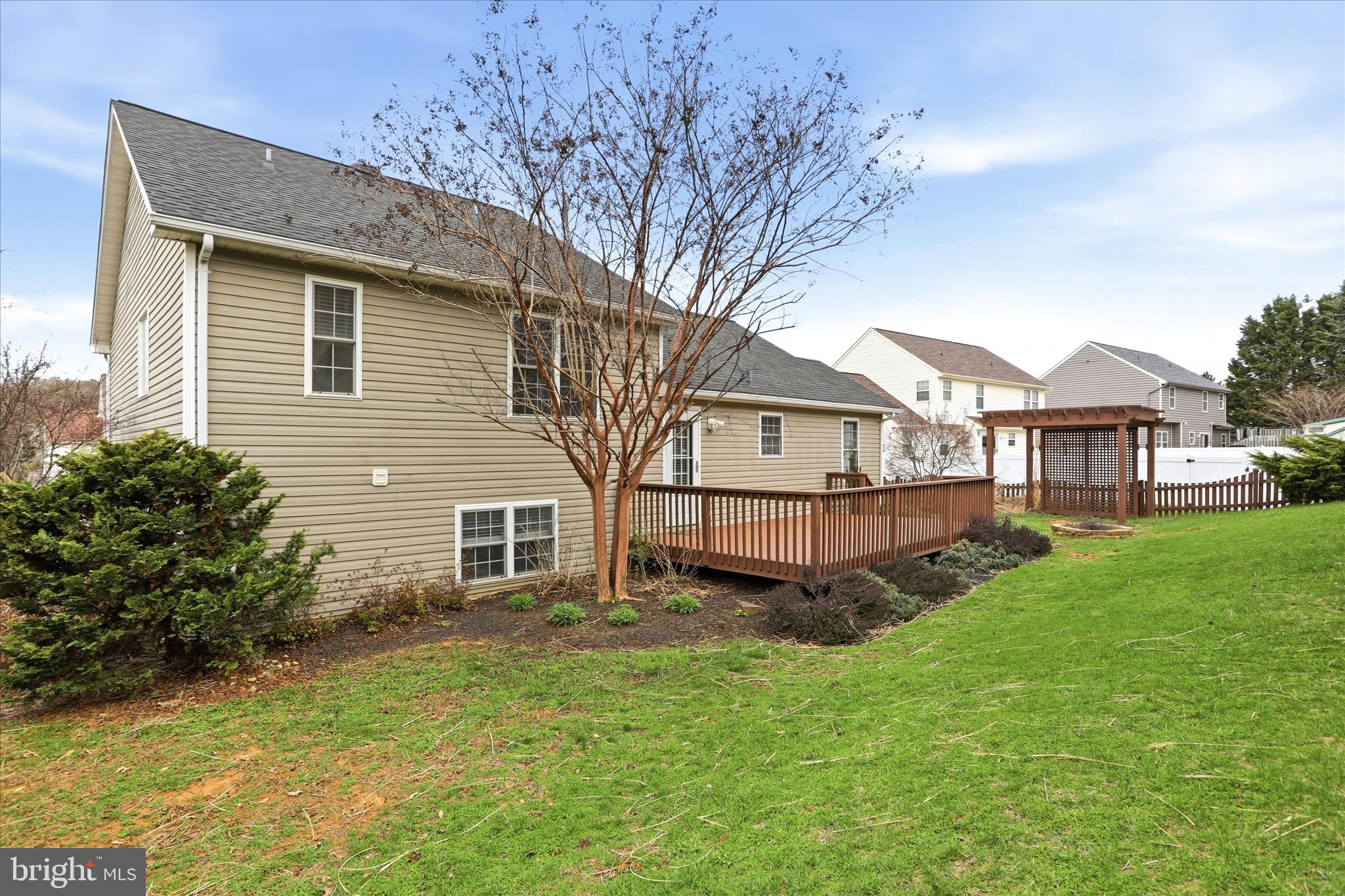 88 Grassy Meadow Road Charles Town, WV 25414 - Photo 37 of 44 a view of a house with a yard and sitting area