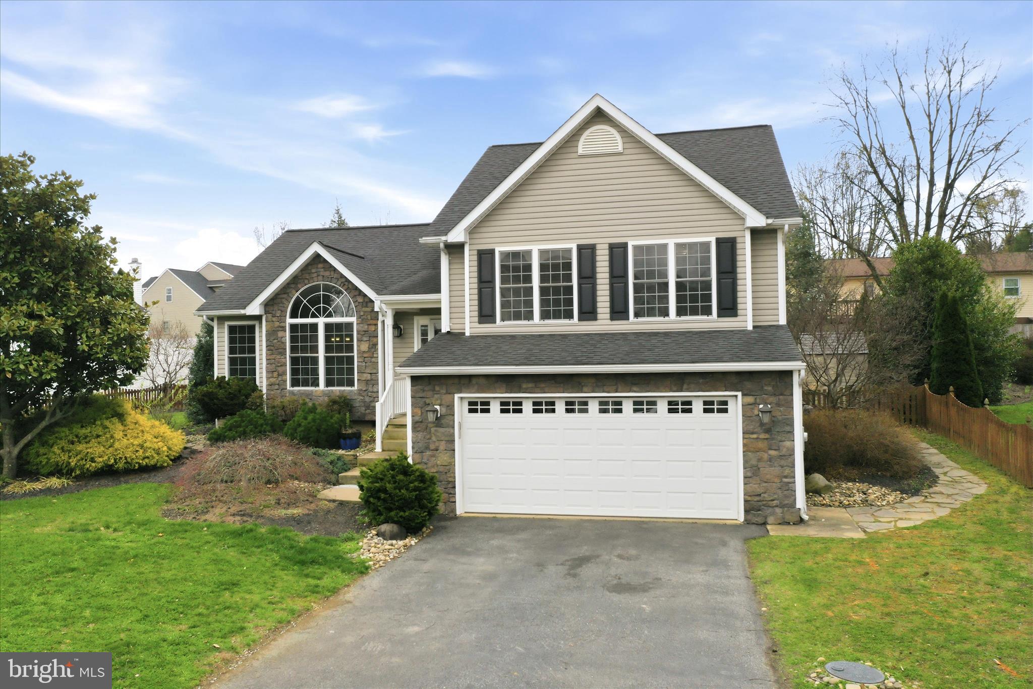 88 Grassy Meadow Road Charles Town, WV 25414 - Photo 44 of 44 a front view of a house with a yard and garage