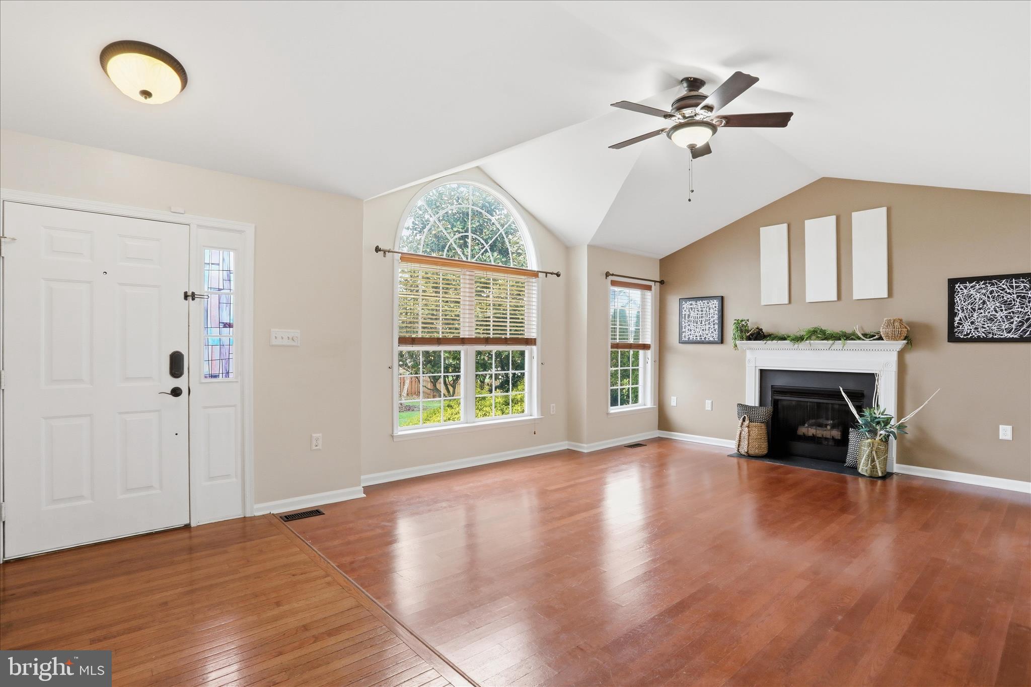 88 Grassy Meadow Road Charles Town, WV 25414 - Photo 5 of 44 a view of an empty room with a window and fireplace