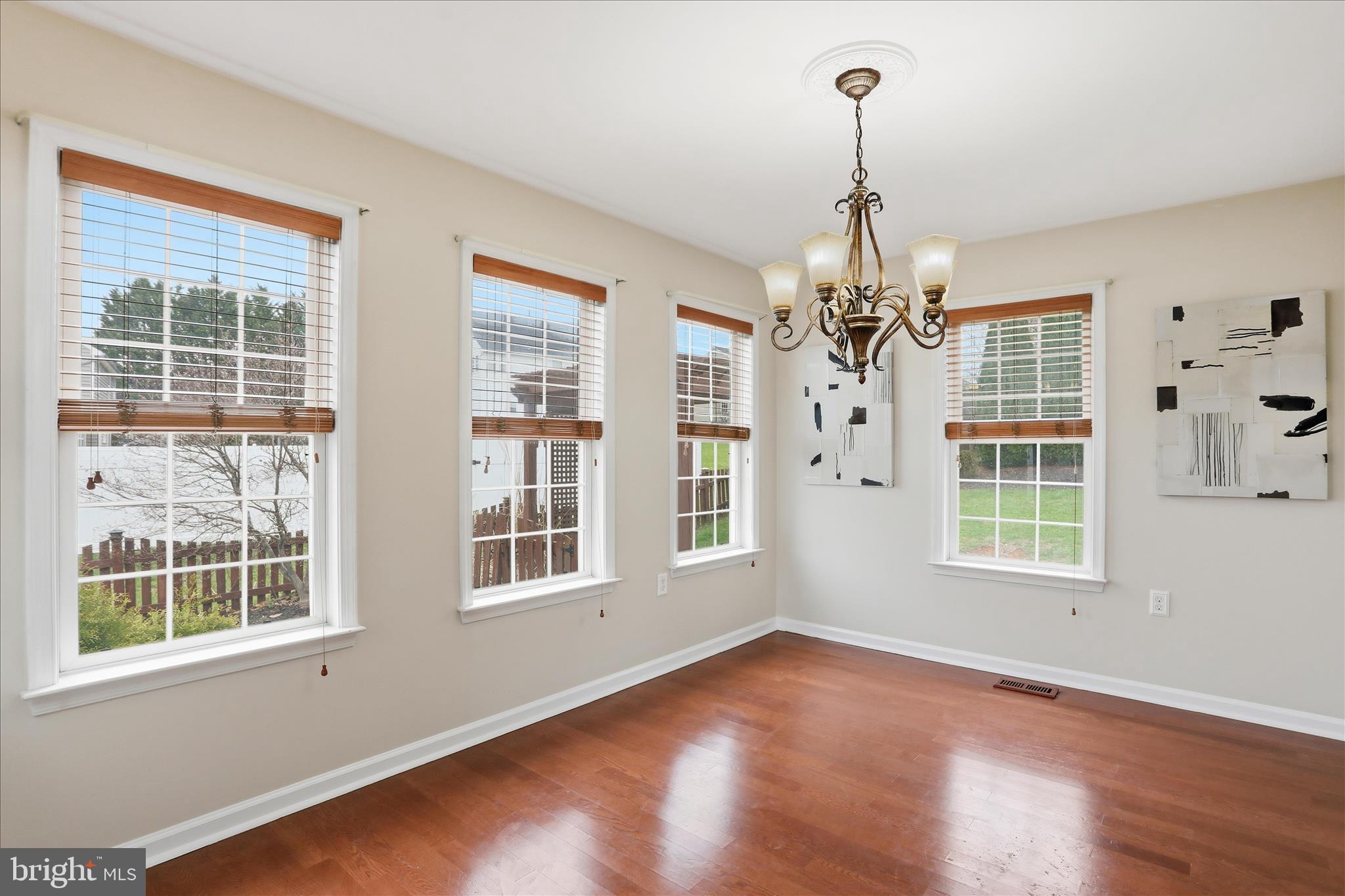 88 Grassy Meadow Road Charles Town, WV 25414 - Photo 7 of 44 a view of an empty room with wooden floor and windows