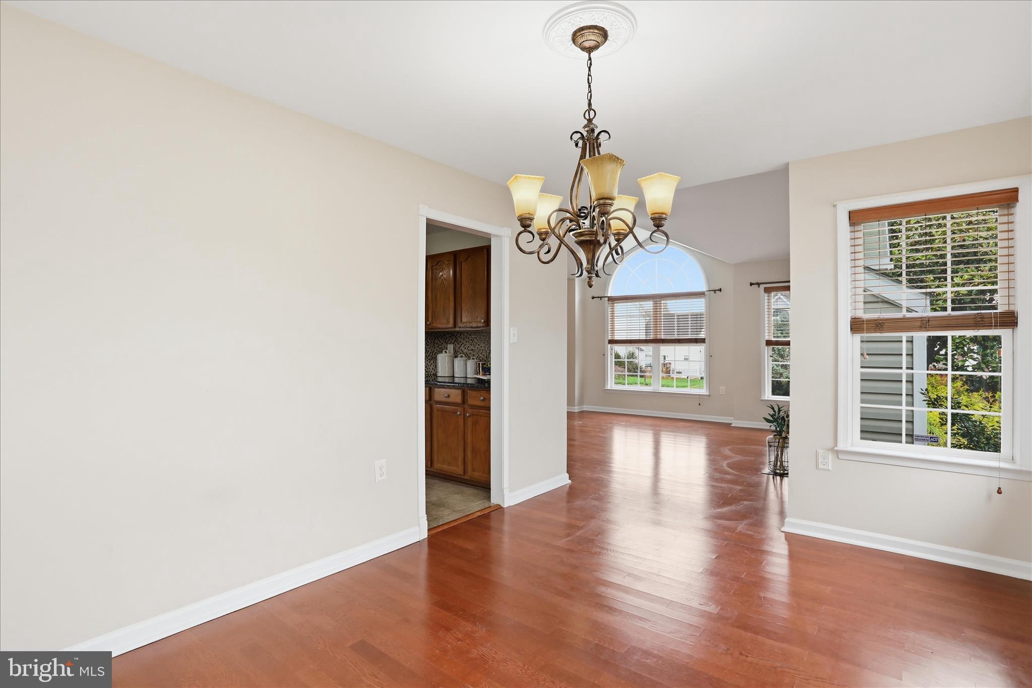 88 Grassy Meadow Road Charles Town, WV 25414 - Photo 8 of 44 a view of a room with wooden floor chandeliers and kitchen