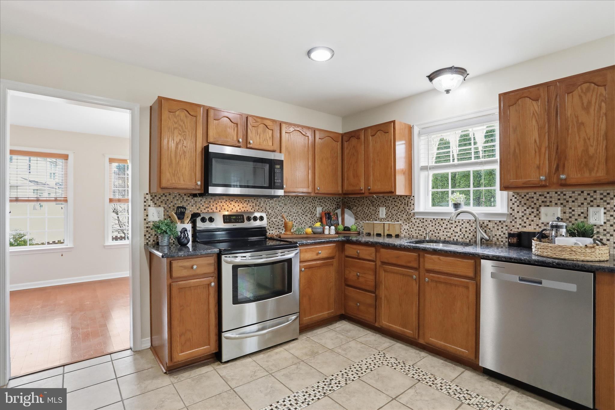 88 Grassy Meadow Road Charles Town, WV 25414 - Photo 9 of 44 a kitchen with sink a microwave and cabinets
