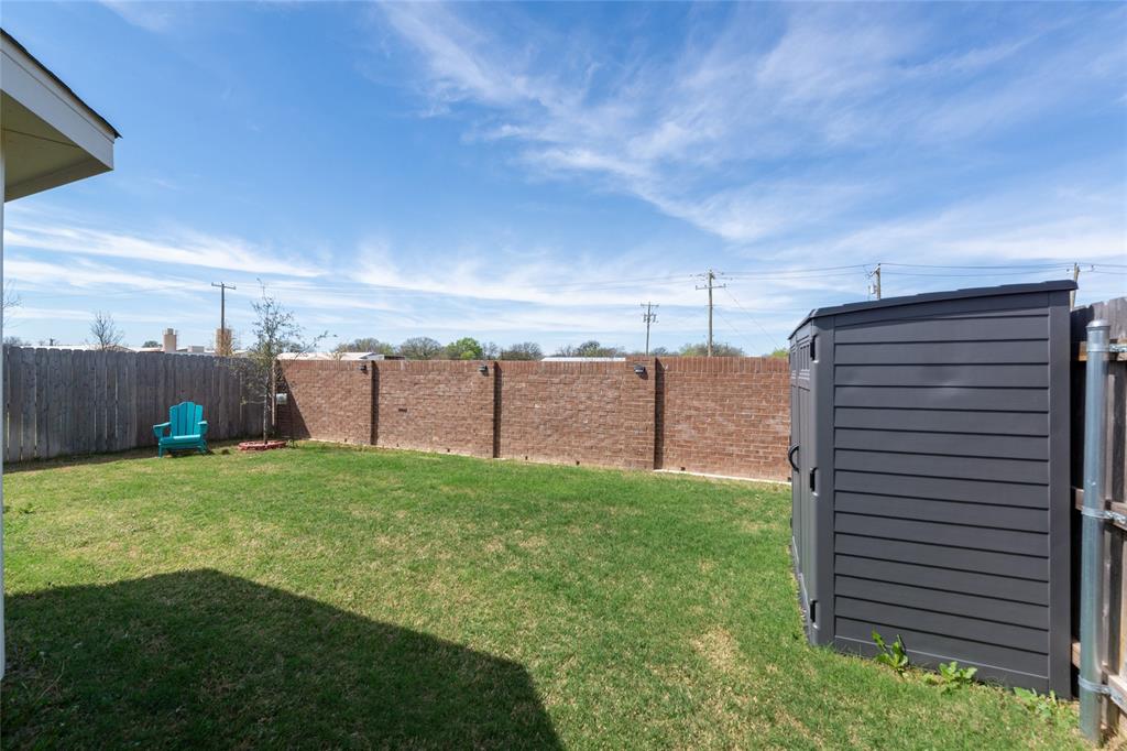 431 Woodhouse Way Everman, TX 76140 - Photo 28 of 30 a view of a backyard with pathway