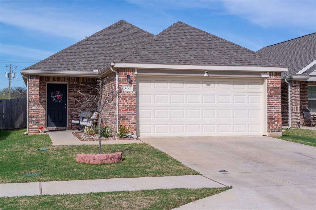 431 Woodhouse Way Everman, TX 76140 - Photo 30 of 30 a front view of a house with garden
