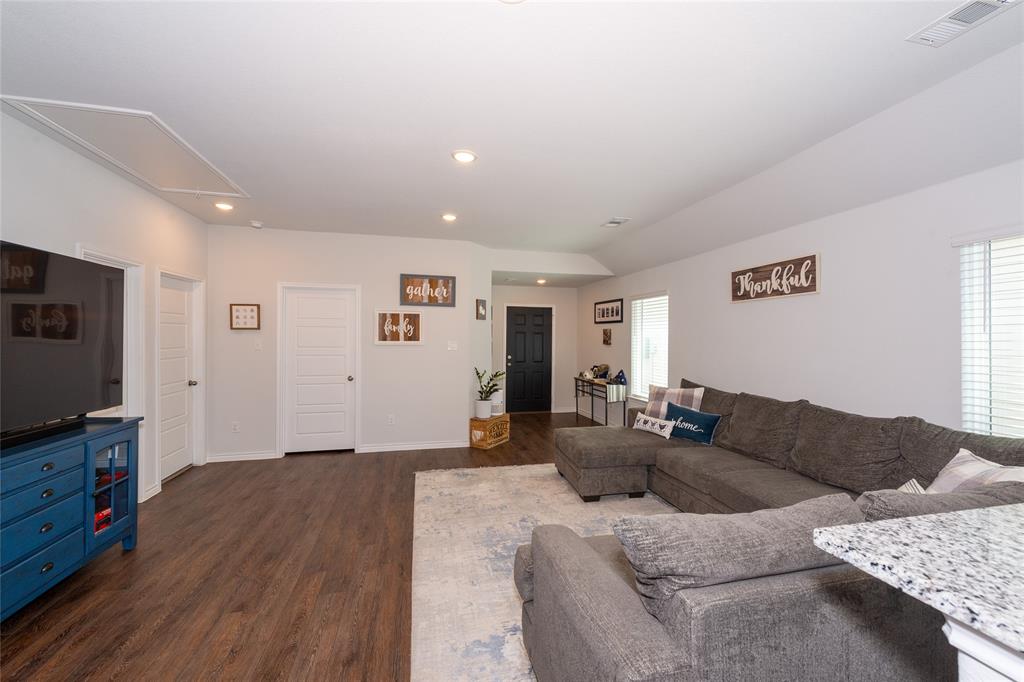 431 Woodhouse Way Everman, TX 76140 - Photo 9 of 30 a living room with furniture and wooden floor