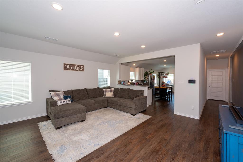 431 Woodhouse Way Everman, TX 76140 - Photo 10 of 30 Living room featuring dark wood finished floors and recessed lighting