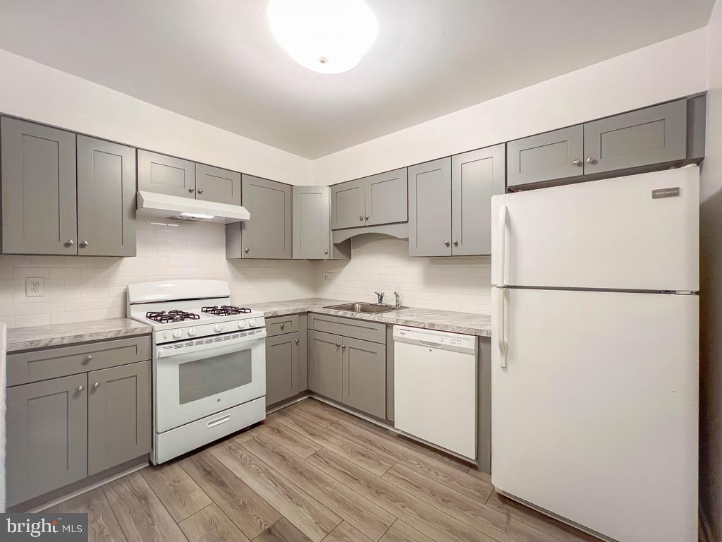 10843 Academy Road Philadelphia, PA 19154 - Photo 17 of 30 a kitchen with stainless steel appliances granite countertop a refrigerator stove a sink and dishwasher