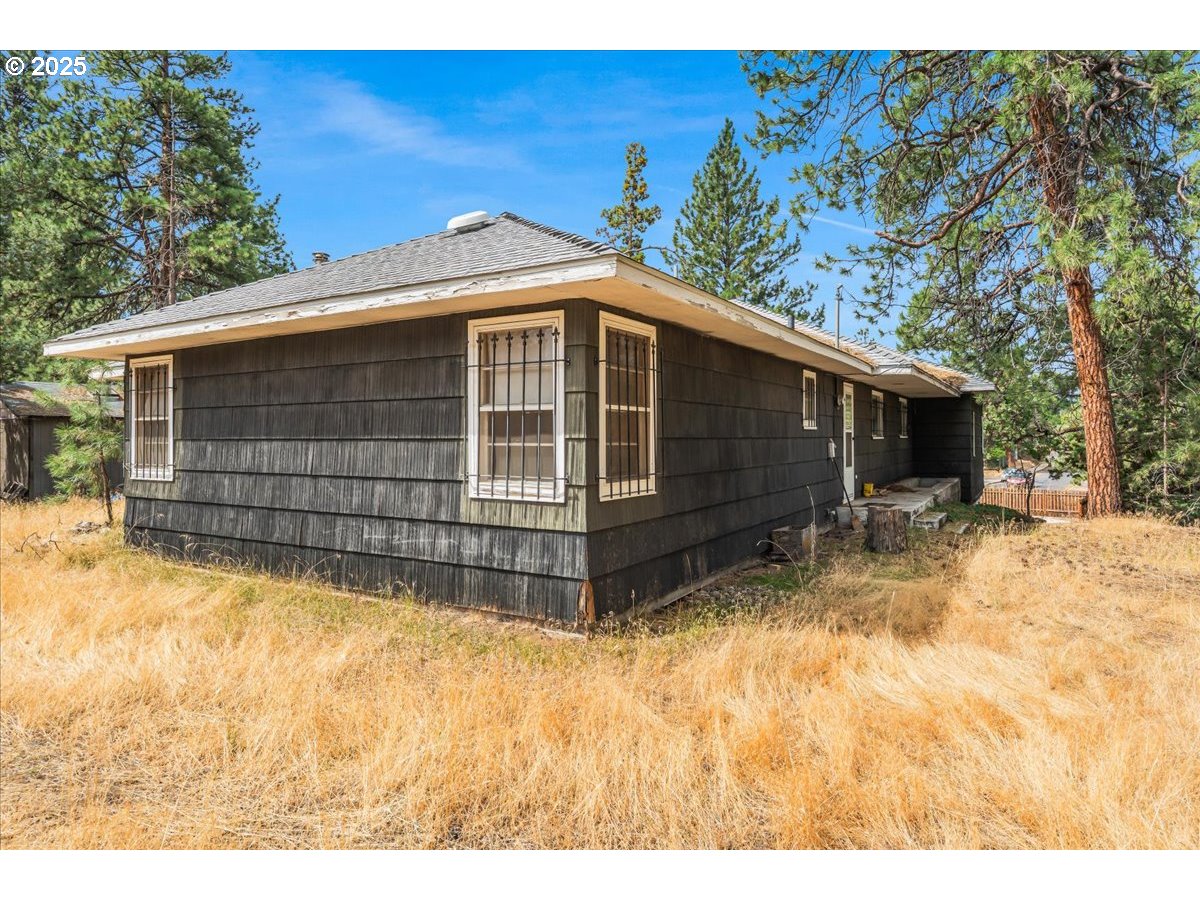438 Northeast 9th Street Bend, OR 97701 - Photo 12 of 29 a front view of a house with a yard