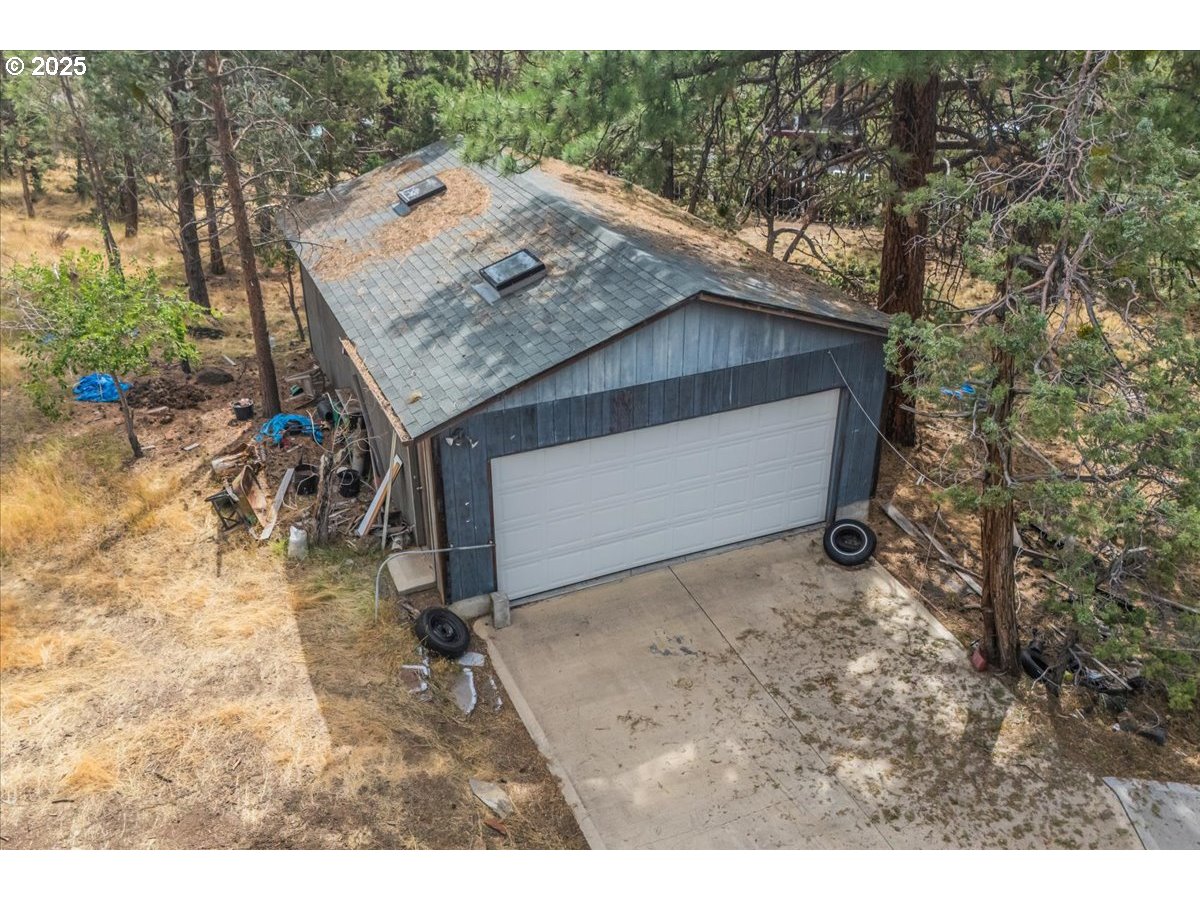 438 Northeast 9th Street Bend, OR 97701 - Photo 14 of 29 a view of a house with a tree in the background