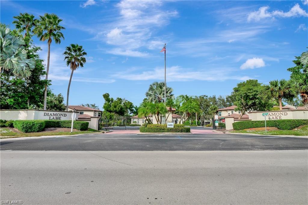 300 Diamond Circle, Unit 302 Naples, FL 34110 - Photo 13 of 14 a street view with a garden