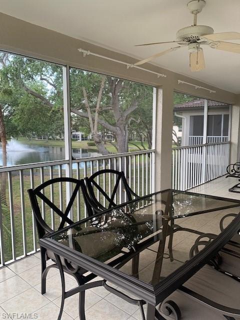 300 Diamond Circle, Unit 302 Naples, FL 34110 - Photo 9 of 14 a view of a balcony with furniture and wooden floor
