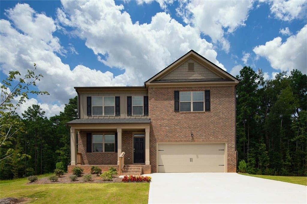 4121 Flat Rock Point Stonecrest, GA 30038 - Photo 1 of 1 a front view of a house with garden