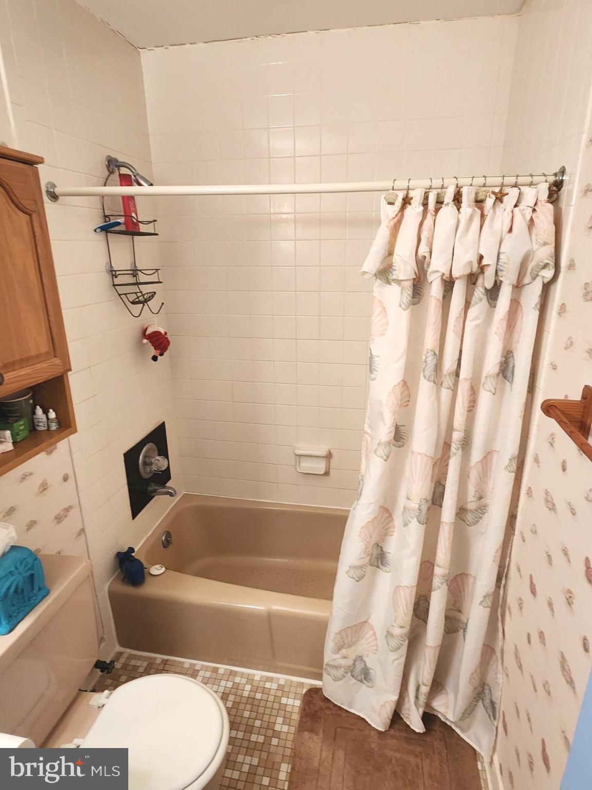 615 Salt Spray Road, Unit 3A Ocean City, MD 21842 - Photo 21 of 23 a bathroom with a bathtub and shower