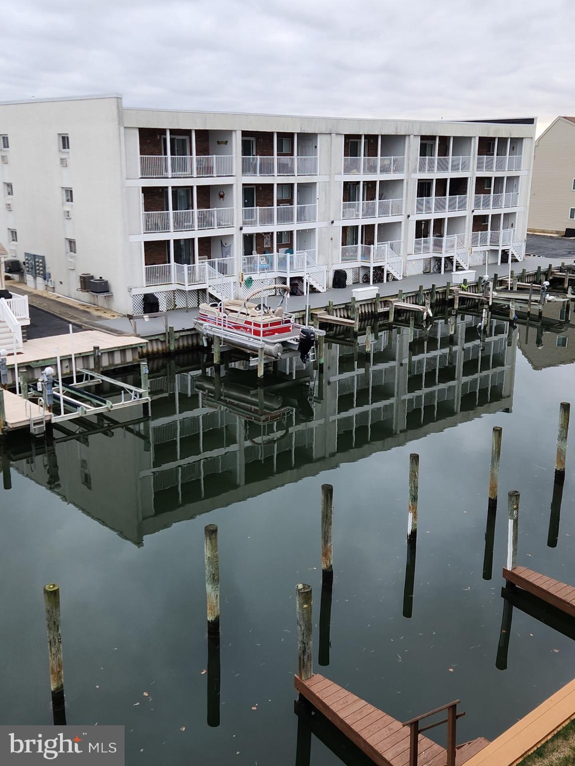 615 Salt Spray Road, Unit 3A Ocean City, MD 21842 - Photo 5 of 23 a view of a roof deck with furniture and front door