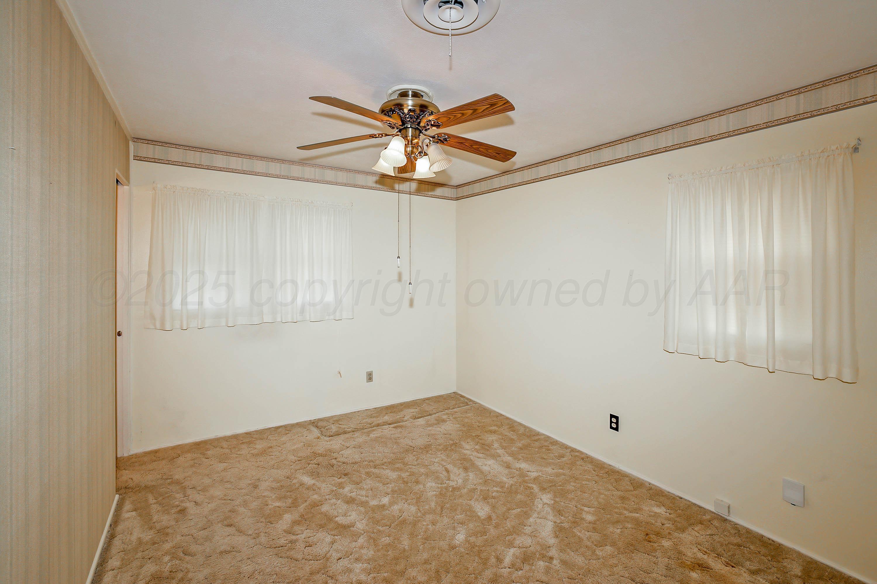 5119 South Bonham Street Amarillo, TX 79110 - Photo 13 of 32 a view of a small space with a fan