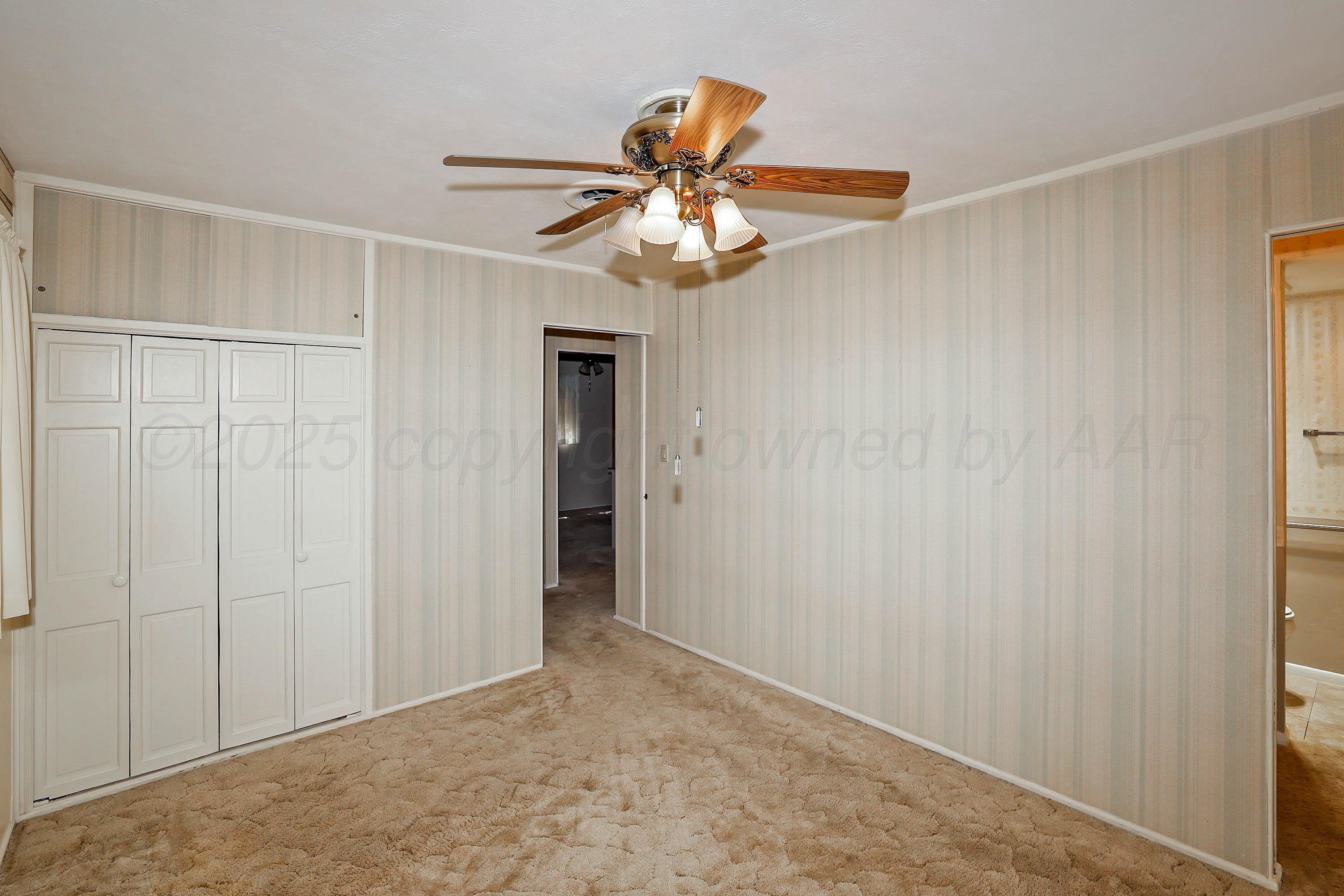 5119 South Bonham Street Amarillo, TX 79110 - Photo 14 of 32 a view of an empty room and chandelier fan
