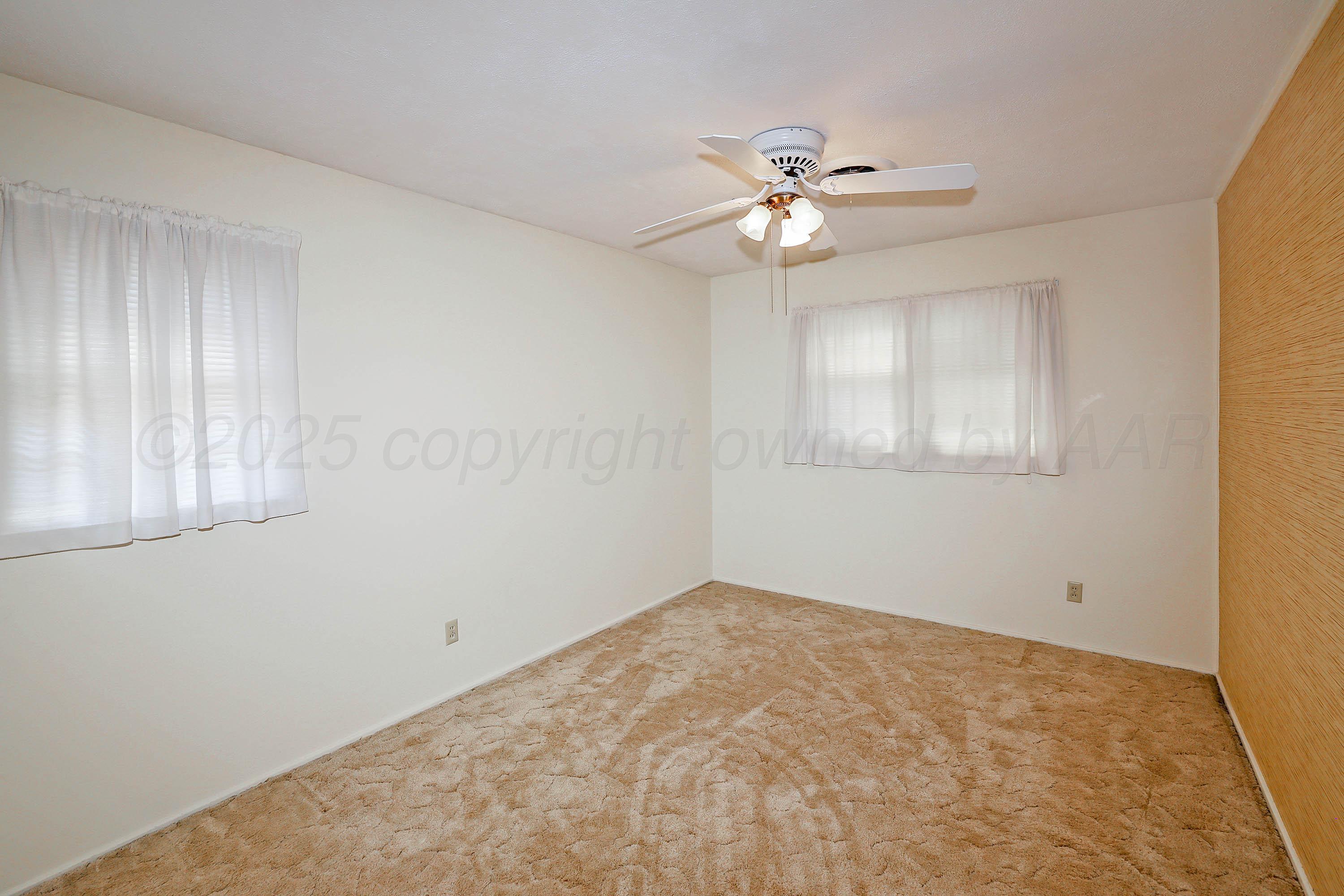 5119 South Bonham Street Amarillo, TX 79110 - Photo 17 of 32 a view of empty room with window