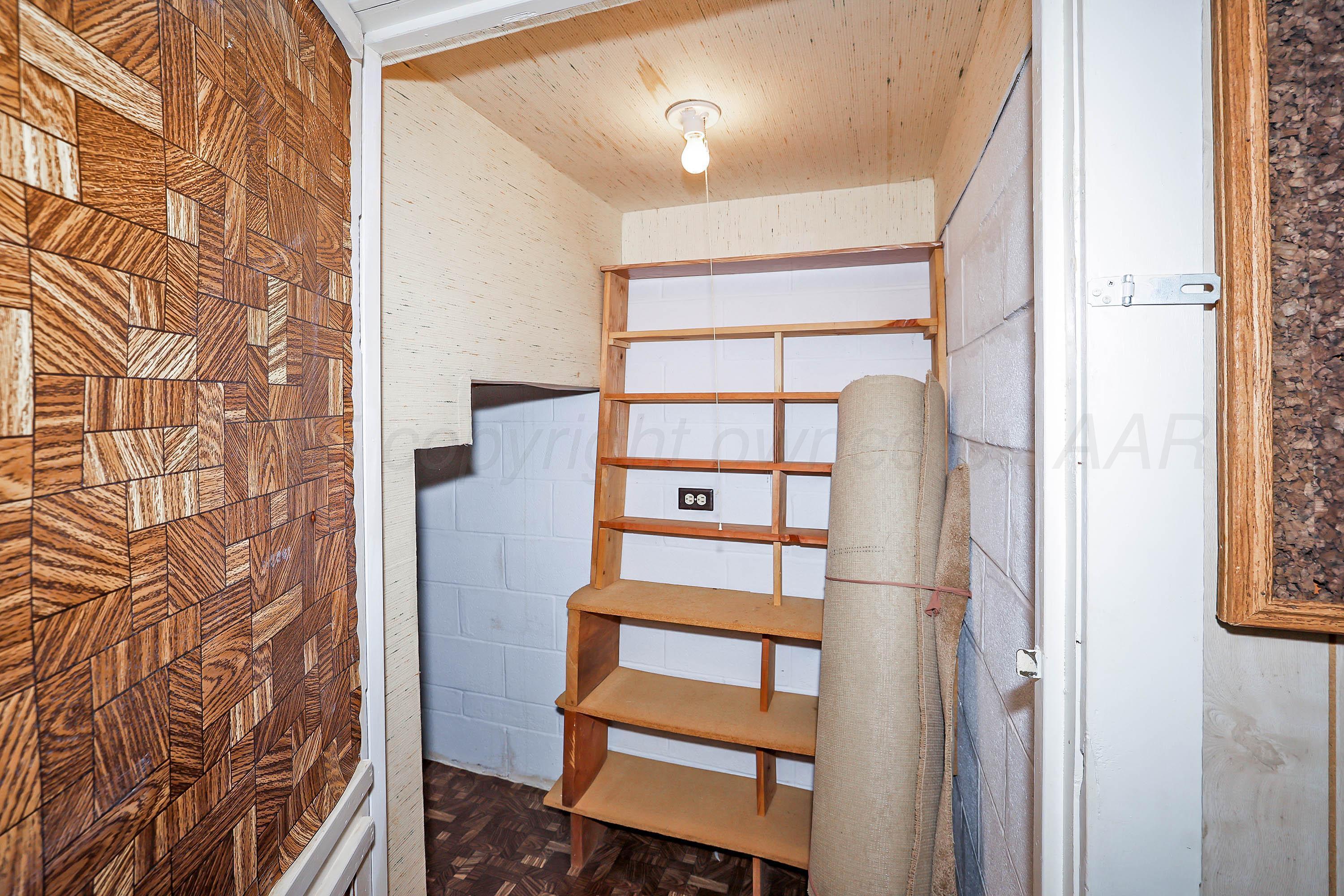 5119 South Bonham Street Amarillo, TX 79110 - Photo 25 of 32 walk in closet with wooden floor