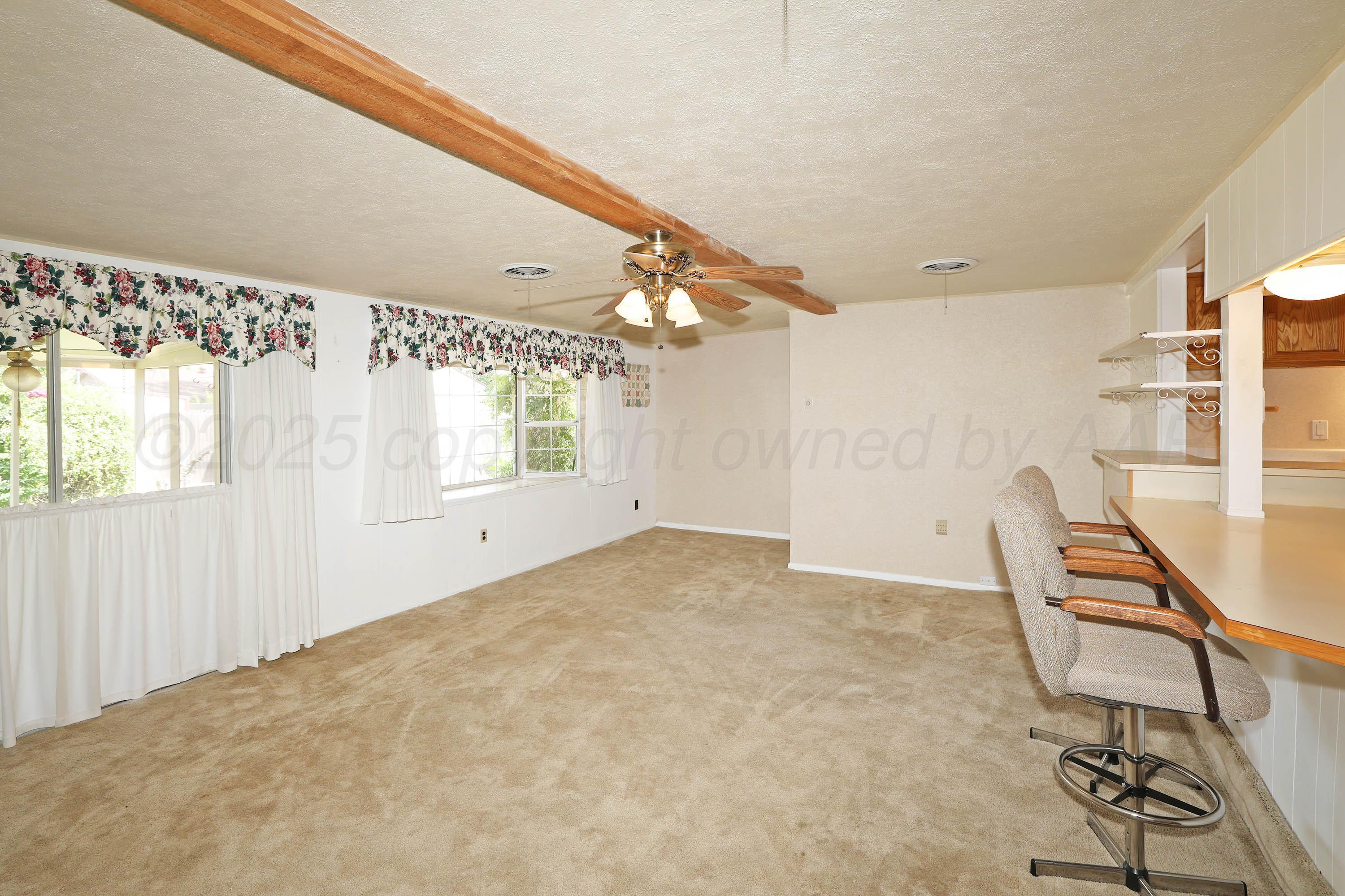 5119 South Bonham Street Amarillo, TX 79110 - Photo 3 of 32 a view of a livingroom with furniture and a window