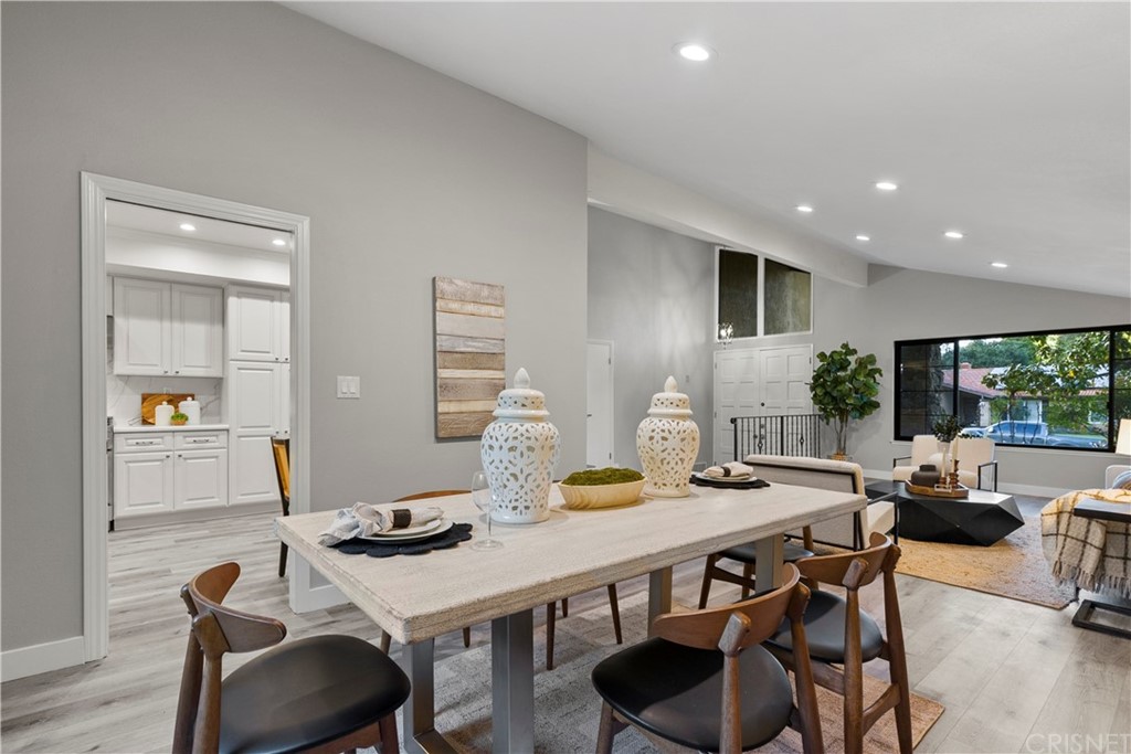 23524 Highland Glen Drive Newhall, CA 91321 - Photo 19 of 53 a view of a dining room with furniture and wooden floor