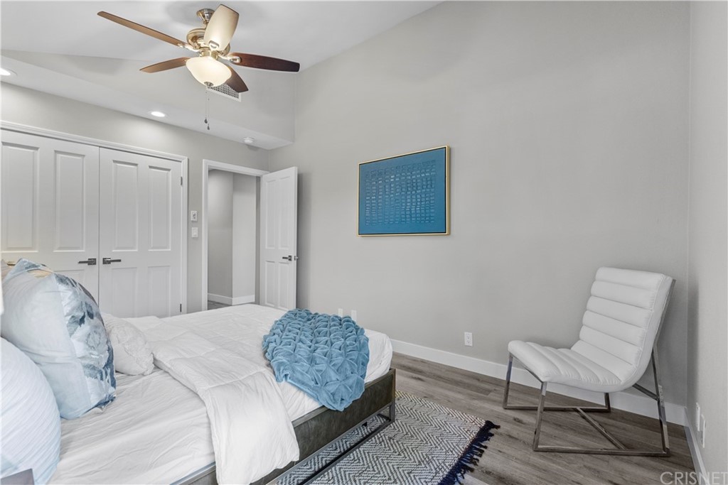 23524 Highland Glen Drive Newhall, CA 91321 - Photo 36 of 53 a bedroom with a bed and a chair