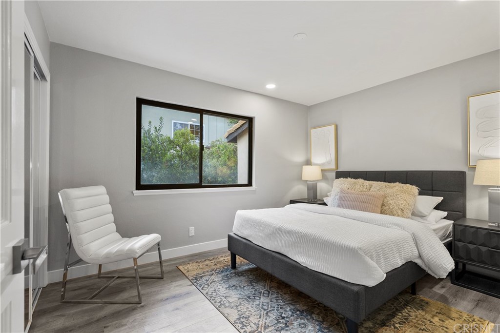 23524 Highland Glen Drive Newhall, CA 91321 - Photo 38 of 53 a bedroom with a bed and a large window