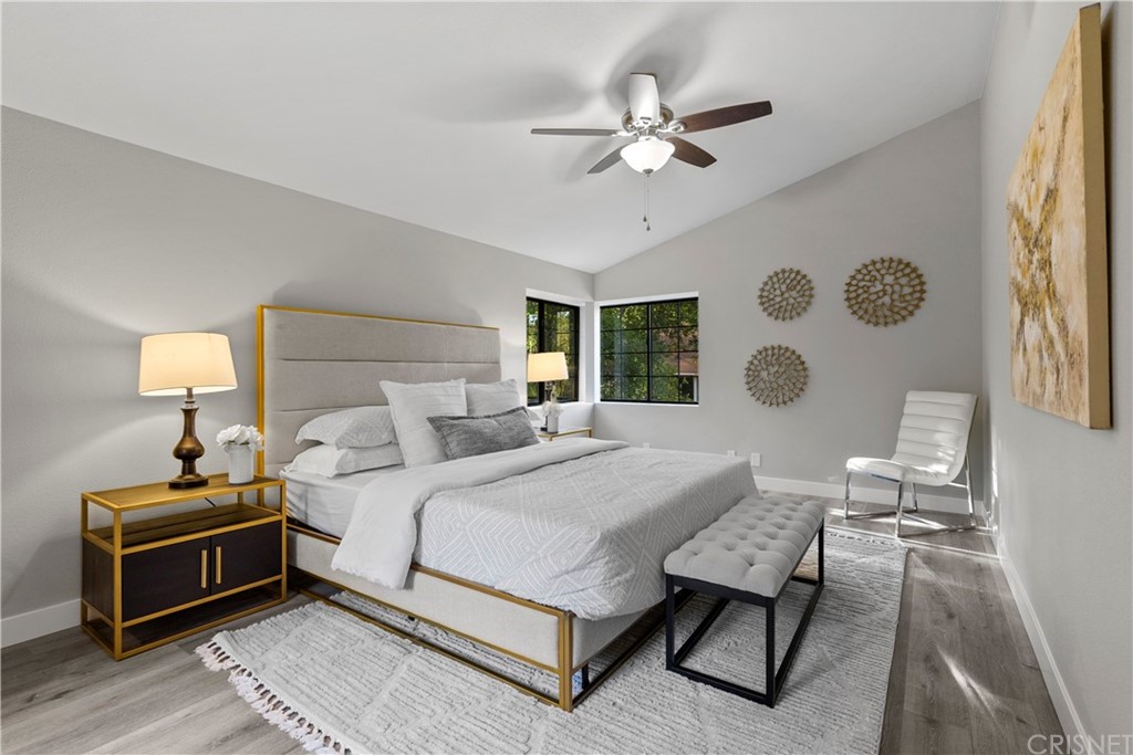 23524 Highland Glen Drive Newhall, CA 91321 - Photo 44 of 53 a bedroom with a bed and a chandelier with a window