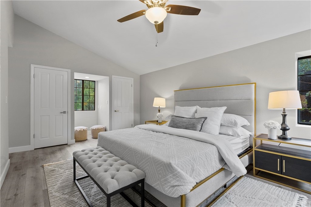 23524 Highland Glen Drive Newhall, CA 91321 - Photo 45 of 53 a bedroom with a bed chandelier and a window