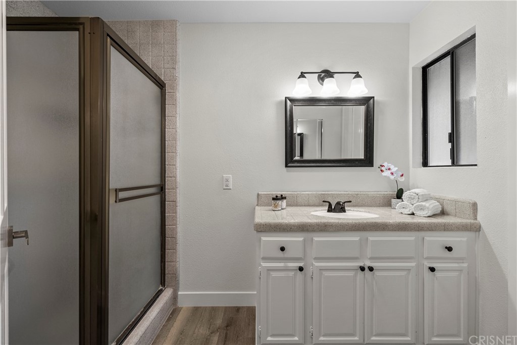 23524 Highland Glen Drive Newhall, CA 91321 - Photo 47 of 53 a bathroom with a sink and a mirror