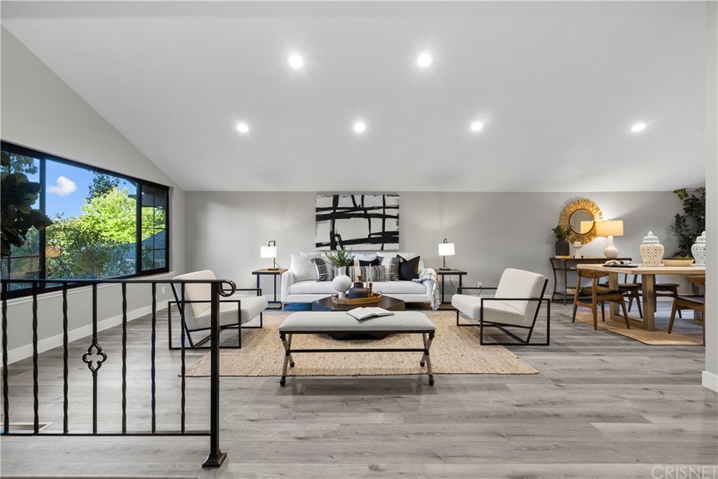23524 Highland Glen Drive Newhall, CA 91321 - Photo 6 of 53 a living room with furniture a rug and a large window