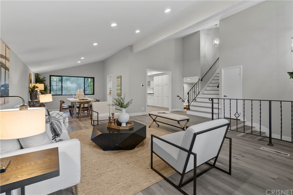23524 Highland Glen Drive Newhall, CA 91321 - Photo 8 of 53 a living room with furniture a wooden floor and potted plant