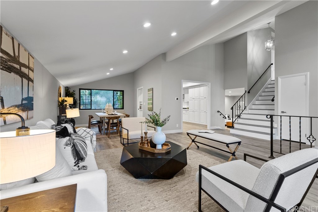 23524 Highland Glen Drive Newhall, CA 91321 - Photo 9 of 53 a living room with furniture kitchen view and a potted plant