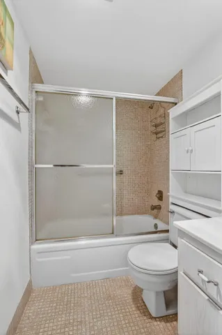 a very nice looking dining room with lots of furniture