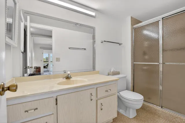 an aerial view of a house with garden space and street view