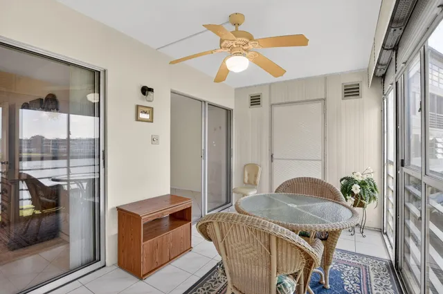 a kitchen with stainless steel appliances kitchen island granite countertop a stove and a sink
