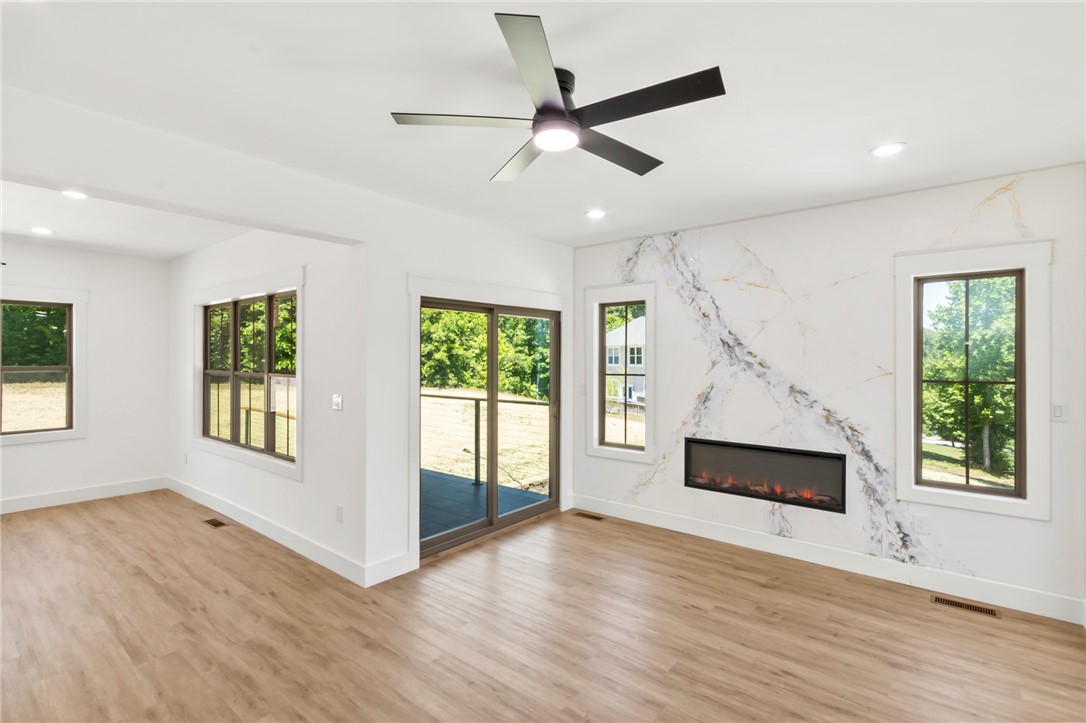 230 Hammond Circle Anderson, SC 29621 - Photo 31 of 48 Bright and airy, this living area features elegant flooring and an inviting fireplace.