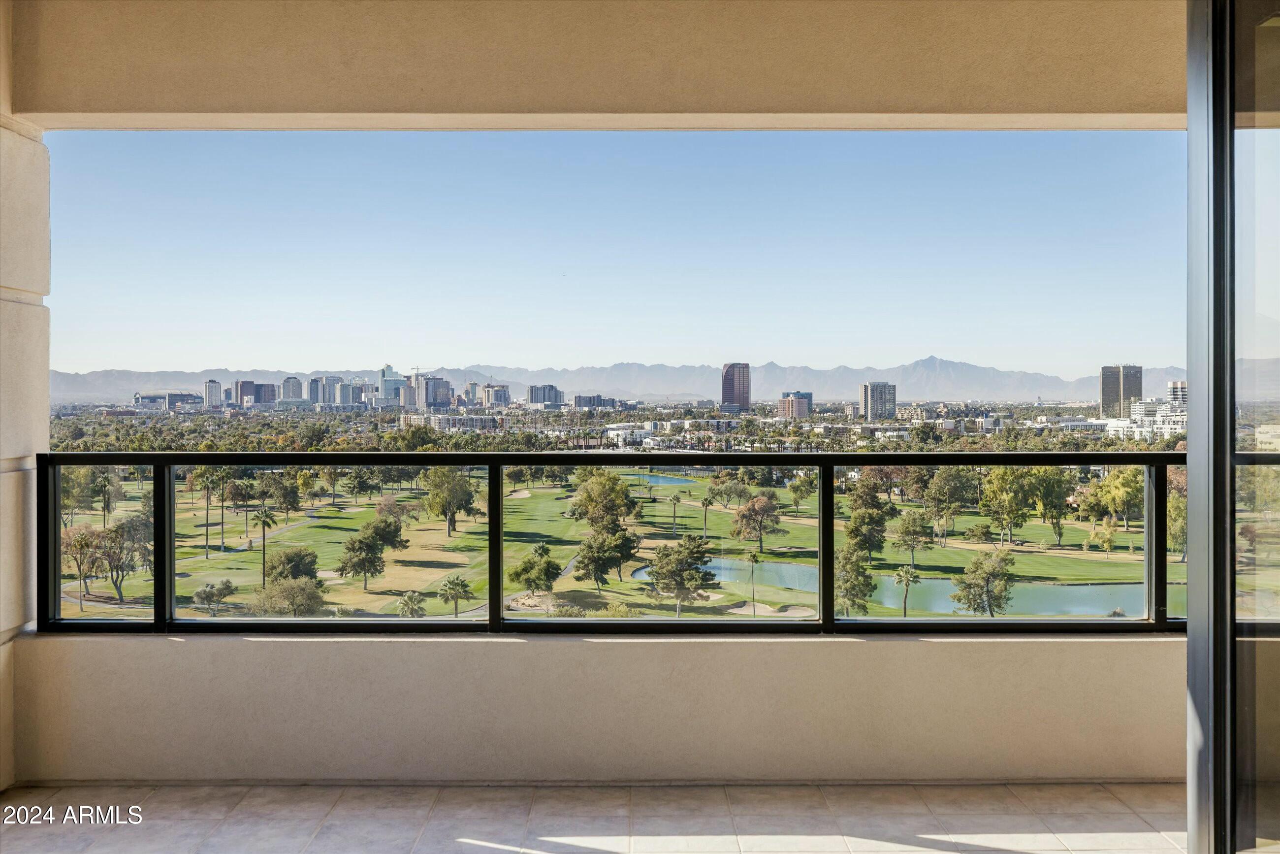 1040 East Osborn Road, Unit 1201 Phoenix, AZ 85014 - Photo 2 of 28 a view of a city skyline
