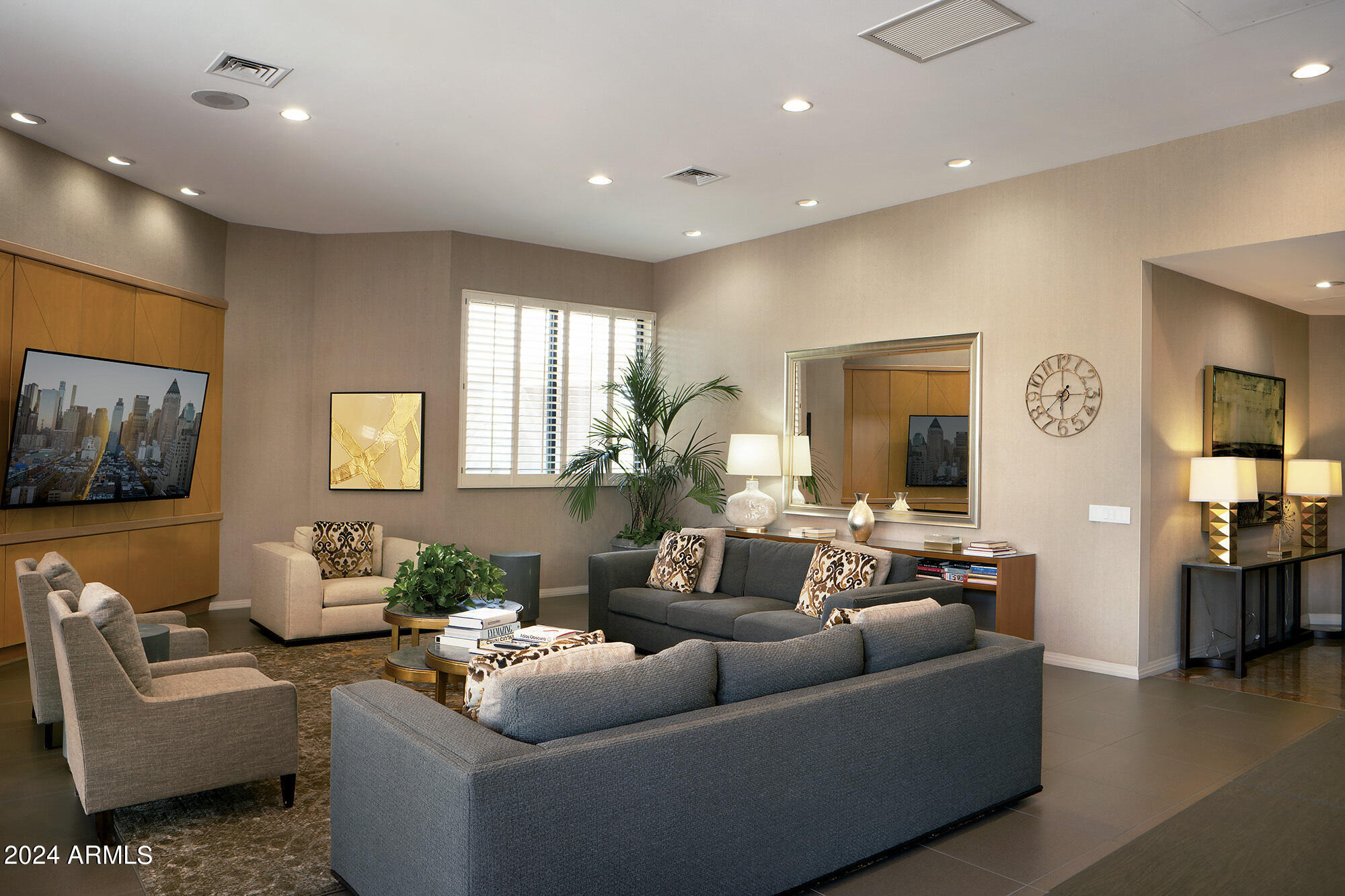 1040 East Osborn Road, Unit 1201 Phoenix, AZ 85014 - Photo 21 of 28 a living room with furniture and a flat screen tv