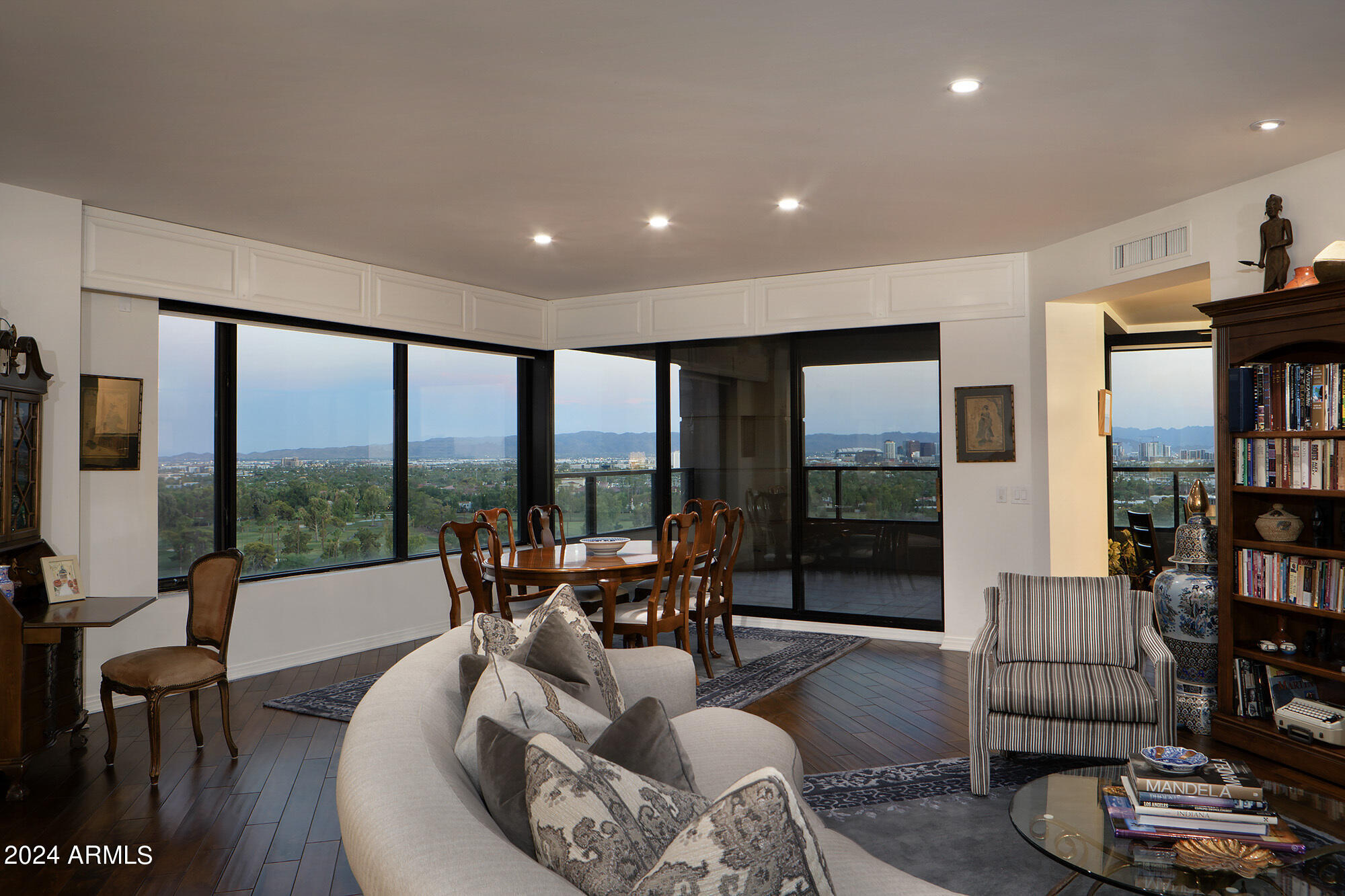 1040 East Osborn Road, Unit 1201 Phoenix, AZ 85014 - Photo 10 of 28 a living room with furniture floor to ceiling window and floor to ceiling window
