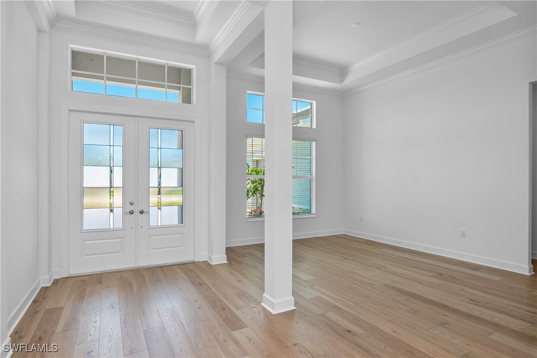 18837 WildBlue Boulevard Fort Myers, FL 33913 - Photo 16 of 49 an empty room with wooden floor and windows
