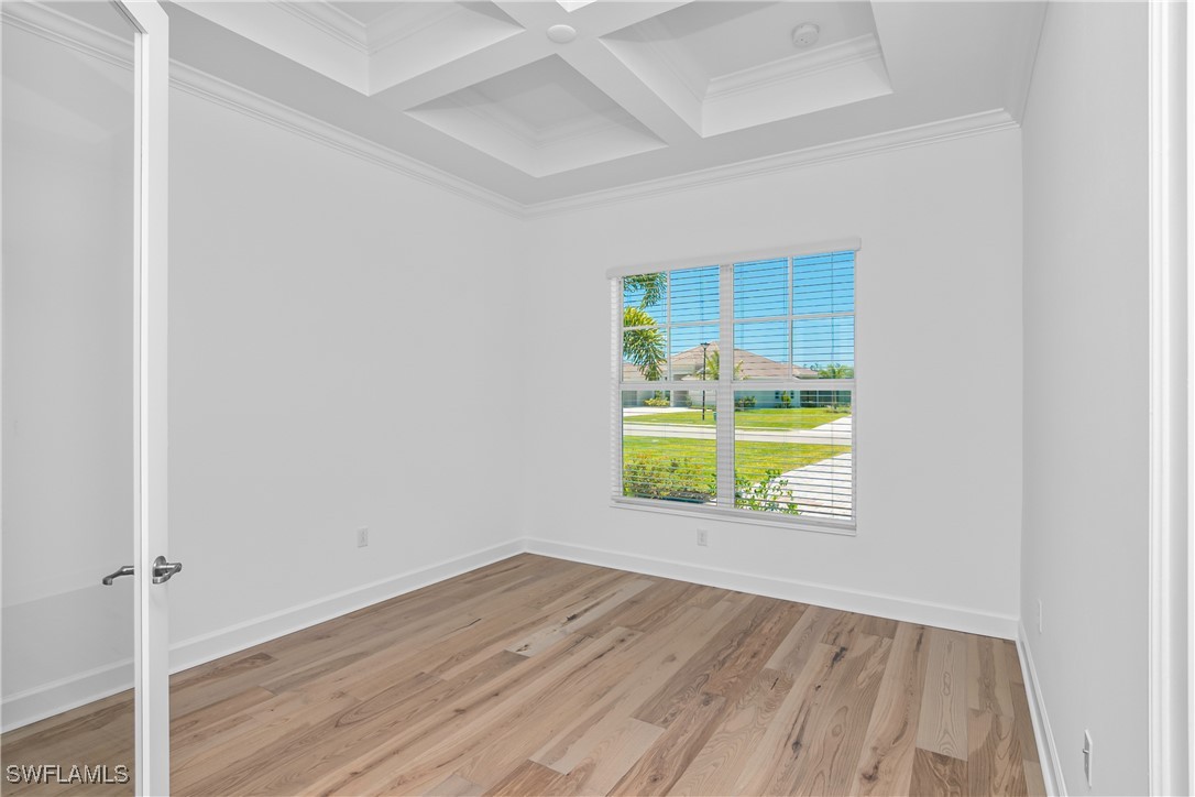 18837 WildBlue Boulevard Fort Myers, FL 33913 - Photo 17 of 49 an empty room with a window and wooden floor