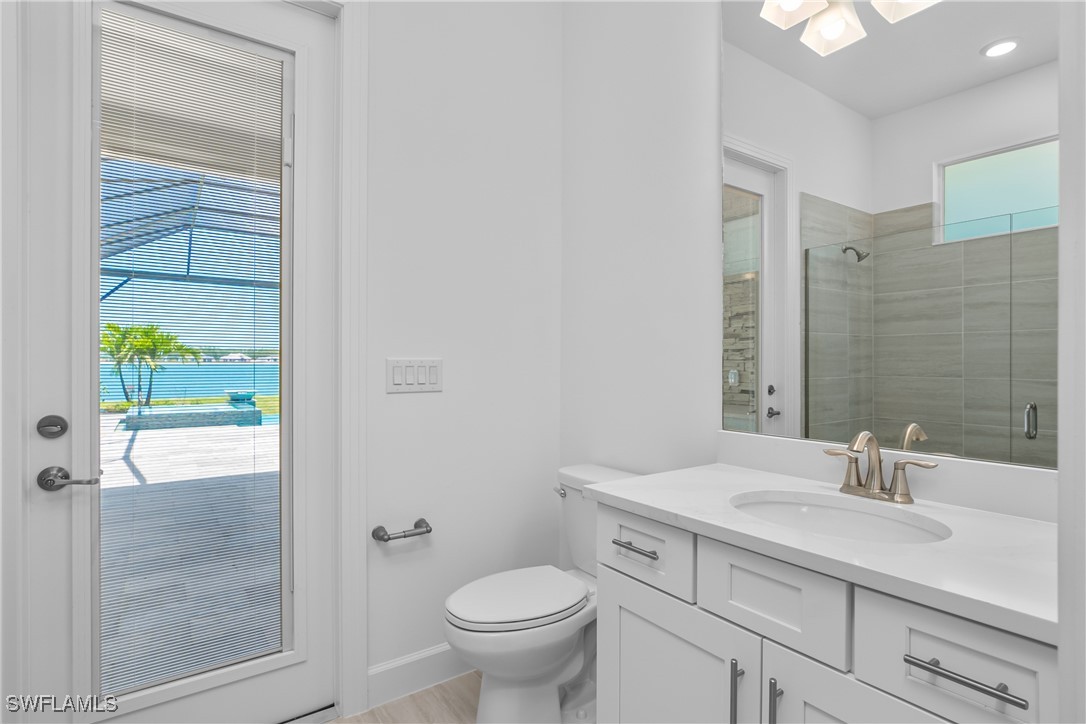 18837 WildBlue Boulevard Fort Myers, FL 33913 - Photo 28 of 49 a bathroom with a sink toilet and shower